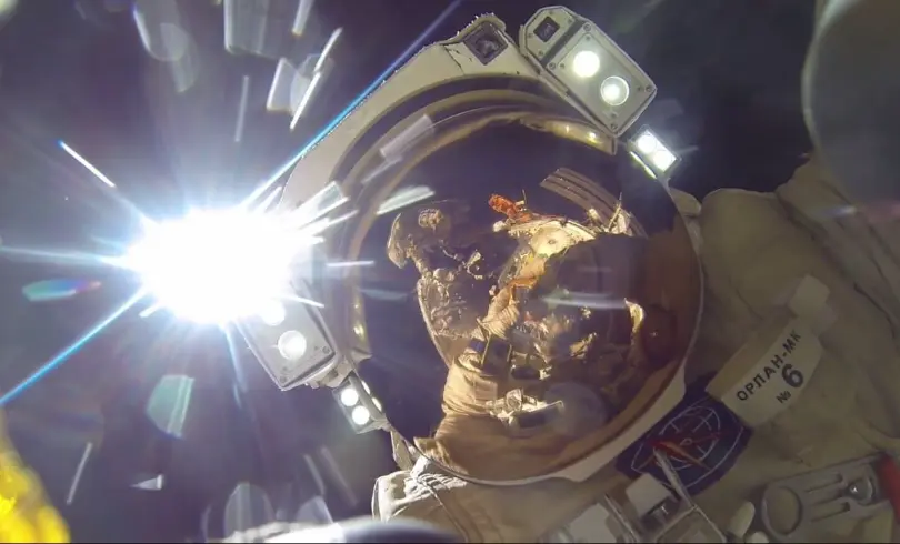Russian spacewalk breaks endurance record via new antenna system installation