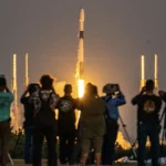 A crowd watches as a SpaceX Falcon 9 rocket launches from Florida. (Image credit: Space.com / Josh Dinner)