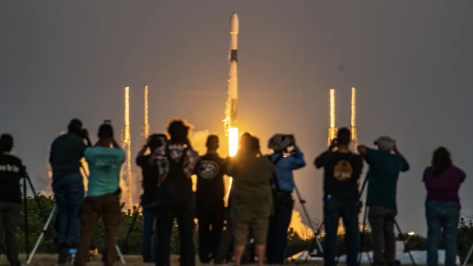 A crowd watches as a SpaceX Falcon 9 rocket launches from Florida. (Image credit: Space.com / Josh Dinner)