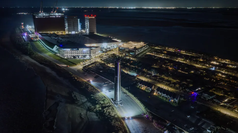SpaceX rolls its Super Heavy booster out to the pad ahead of Starship's 14th flight test, which is targeted for Sept. 28, 2026.