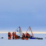 Members of China's 16th Arctic Ocean scientific expedition team work on the ice surface of the Arctic Ocean on Aug. 9, 2026.