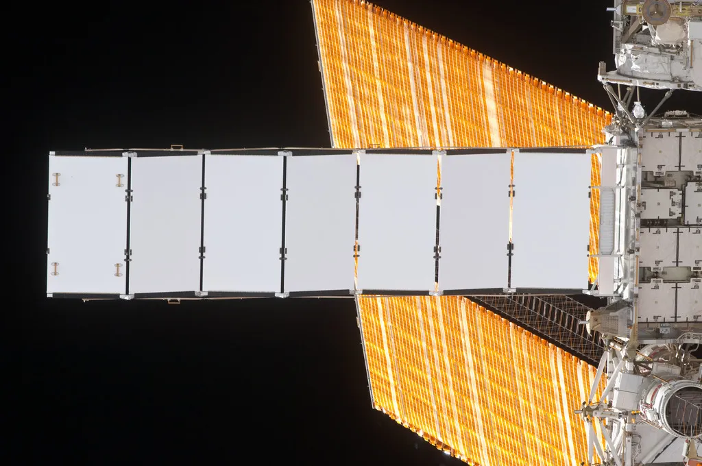 Nadir view of the S4 Truss radiator, taken by an STS-130 crewmember aboard the orbiter Endeavour during its approach for joint operations with Expedition 22. An S4 solar array wing (SAW) is also visible.